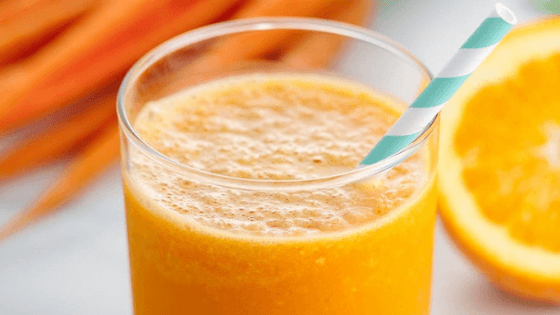 an orange, ginger, carrot and turmeric juice