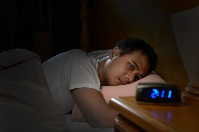 man suffering with a sleep disorder